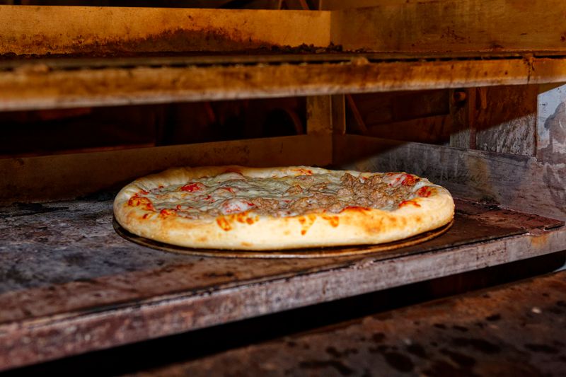 Green lantern pizza fresh dough preparation in our kitchen