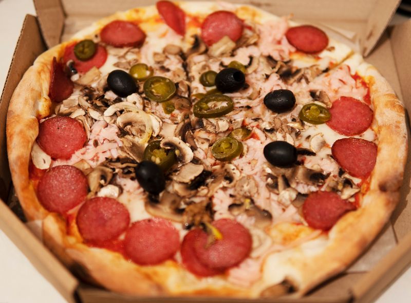 Spicy Diablo pizza with jalapeños and hot sausage