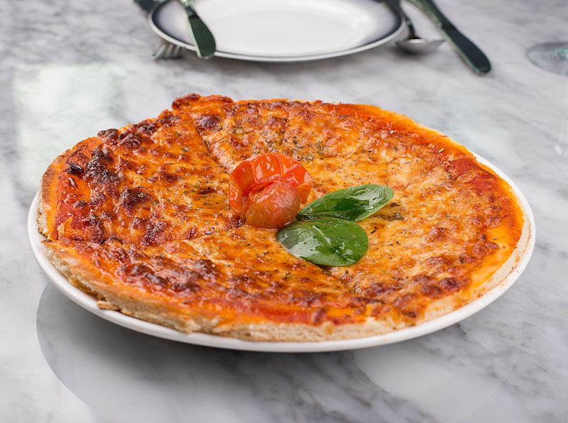 Classic Neapolitan pizza in a traditional wood-fired oven