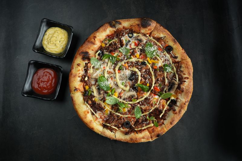 BBQ Chicken pizza with grilled chicken and tangy barbecue sauce